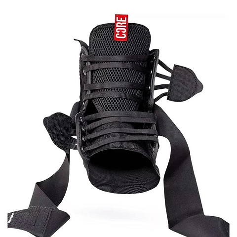 The CORE Ankle Protection Brace - Black, by CORE, is depicted from the front and features adjustable laces and straps. It includes a red "CORE" tag at the top. The open design emphasizes excellent ankle support and flexibility for optimal protection.