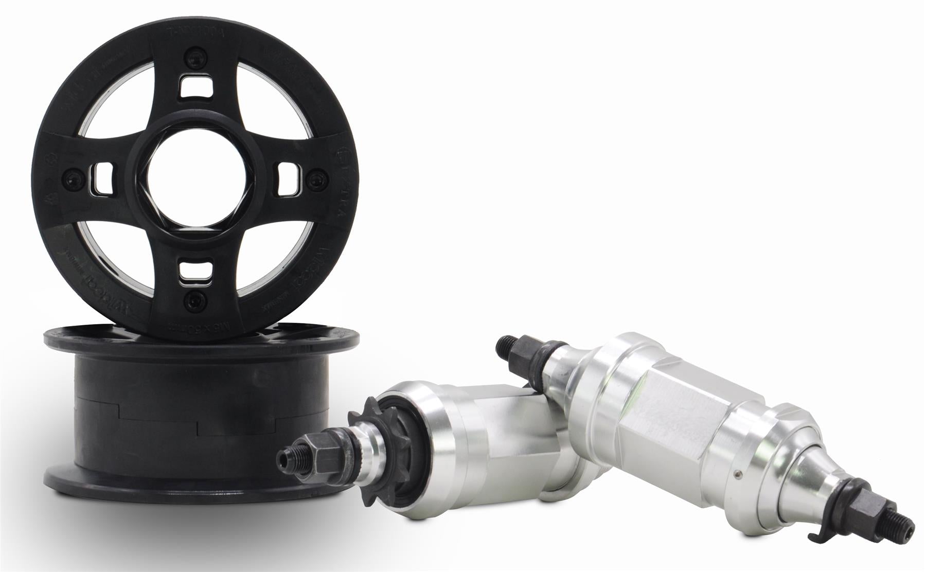 Two black plastic wheels with CNC aluminum rims and silver hubs with black axle bolts, made by Wildcat for the Wildcat OG 3A Mini BMX Bike - Royal Blue, are displayed on a white background—ideal replacement parts.
