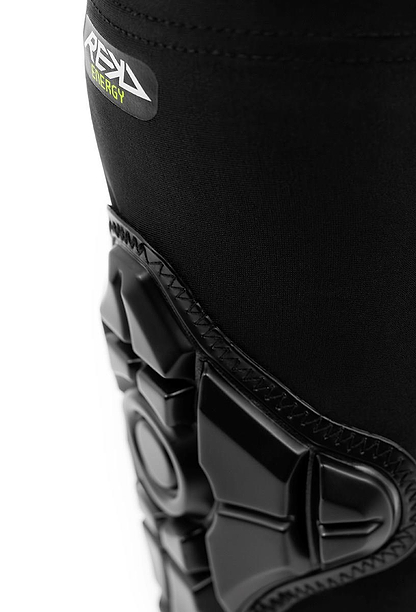 Close-up of a black REKD Energy Elbow Skate Protection Gasket with geometric patterns and a small “REKD” label near the top, featuring Energy Foam for advanced impact protection. The background is white.