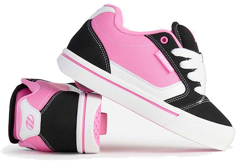 A pair of Heelys Pro 25 V2 Girls Shoes in black, white, and pink—one shows the sole with the signature wheel, while the other stands upright to highlight the side, laces, and classic 90s-inspired style. Brand: Heelys.