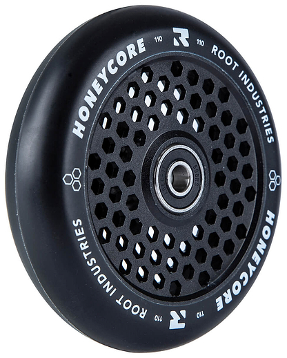 The Root Industries Honeycore 110mm Stunt Scooter Wheel in black features a honeycomb-patterned core and white branding, ideal for riders seeking lightweight performance. Shown on a white background.