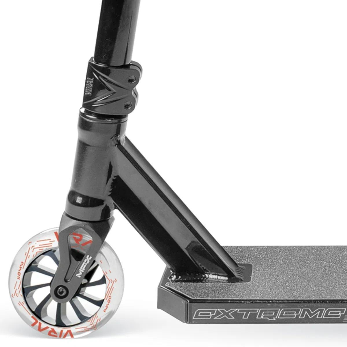 The Madd Gear Viral Extreme Complete Stunt Scooter - Black Shadow by MGP features a black design with white wheels.