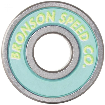 Close-up of Bronson Speed Co.'s Samarria Brevard Pro G3 Skateboard Bearing, showcasing a teal seal and yellow lettering on the silver inner ring.