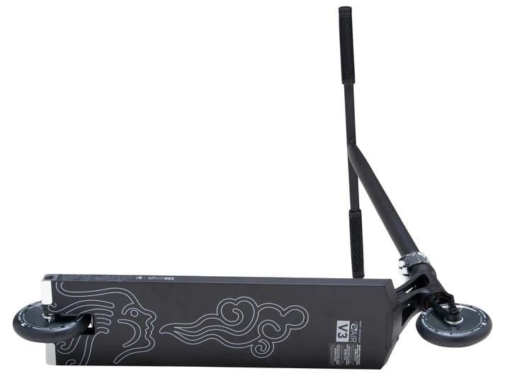 The Root Industries AIR RS V3 Complete Stunt Scooter in black lies on its side, displaying its deck with white cloud-like graphics and two small wheels, while the lightweight handlebars extend upward on the right.