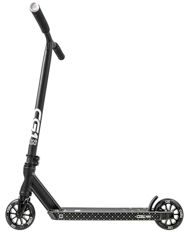 The CORE CG1 Mini Complete Stunt Scooter for kids features a black design with white "CORE" branding on the handlebars, small solid wheels, and a textured foot deck, shown side-on against a white background.
