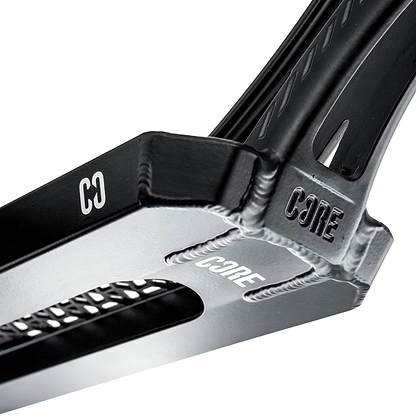 Close-up of the CORE SL3 Forged Black Stunt Scooter Deck (5.25" x 19.3"/20.5") by CORE, featuring engraved and printed branding, textured details, and a rectangular cutout—ideal for park scooter setups.