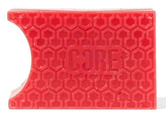 The CORE Epic Skate Wax in Cherry Red is a rectangular block featuring a honeycomb pattern and embossed with the word "CORE" for ultimate grip. It is perfect for smooth grinding, with pre-grooved shapes designed to enhance your skating experience.