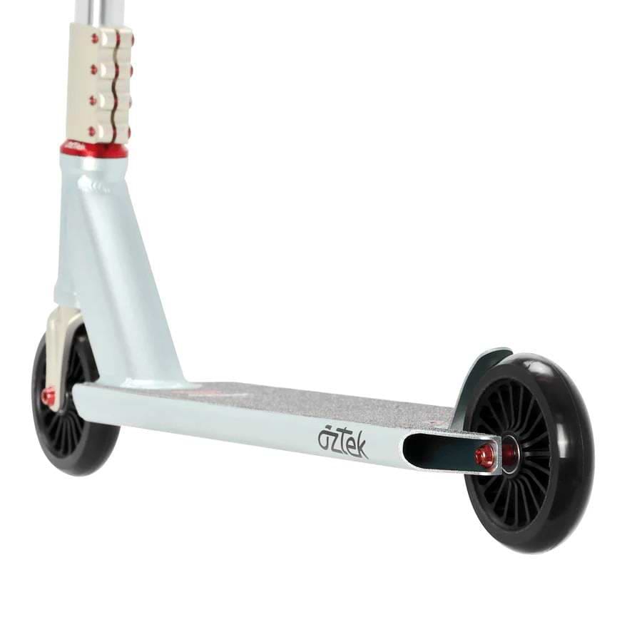 A close-up of the Aztek Corsa Complete Stunt Scooter - Blue shows its deck, rear wheel, and handlebar stem. This lightweight Aztek scooter features black wheels and red axle bolts—ideal for park riders.