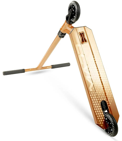 The Madd Gear Viral KAOS Complete Stunt Scooter in copper is shown from a low angle, highlighting its geometric-patterned deck, black wheels, and black-gripped handlebars as the scooter is tilted upward on one wheel.
