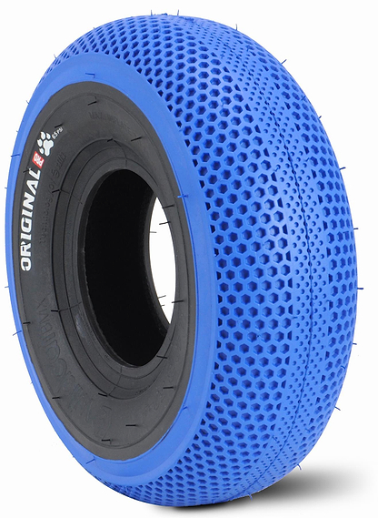 The Wildcat OG Pro Mini BMX Bike - Joker Blue Neochrome features a Turbo wheel design with a blue honeycomb-patterned tire, solid black "Original" inner ring, and rubber tread spikes—ideal for Pro Series Mini BMX setups.