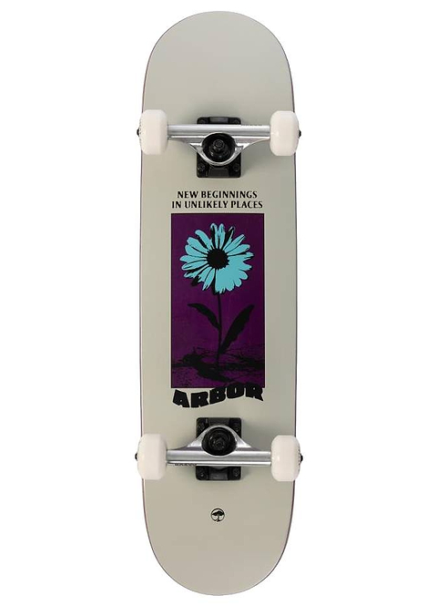The Arbor Street Revert Daisy Mini Complete Skateboard - 7.5″ x 28.5″ features white wheels and a blue daisy graphic on purple with “NEW BEGINNINGS IN UNLIKELY PLACES” above and “ARBOR” below, made of sustainable maple.