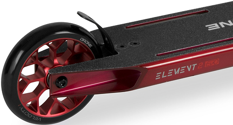 Close-up of a Drone Element 2 Evo Complete Stunt Scooter - Trans Red deck and rear wheel, showing the brake, grip tape, and the text “ELEMENT 2 EVO” on the side of the frame.