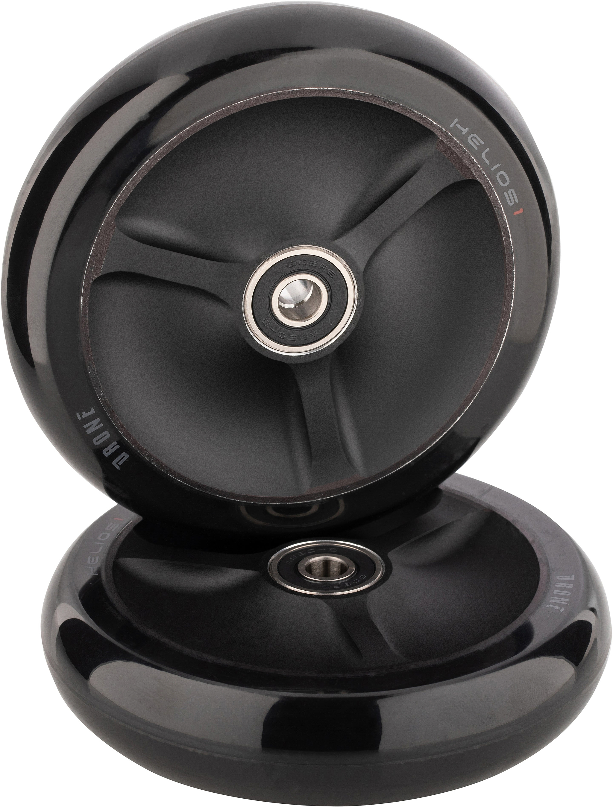 Two black Drone Helios 1 110mm Stunt Scooter Wheels with hollow core construction, three-spoke designs, and center bearings.