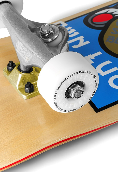 Close-up of the Enuff Lucky Cat Natural Complete Skateboard - 8.0" x 32", featuring a white wheel with text, silver truck, and vibrant graphic on natural wood deck—perfect for beginner street and park skaters.