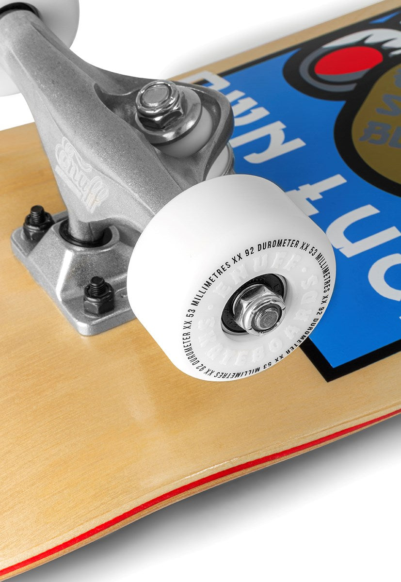 Close-up of the Enuff Lucky Cat Mini Natural Complete Skateboard - 7.25" x 29.5" by Enuff, showing its front truck, white wheel, and part of the light wood deck with blue and red graphics—a great beginner or kids skateboard.