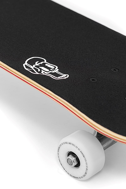 Close-up of the Enuff Lucky Cat Mini Red Complete Skateboard (7.25" x 29.5") by Enuff, featuring black grip tape with a white graphic, layered wooden deck, and white wheels—ideal for beginners.