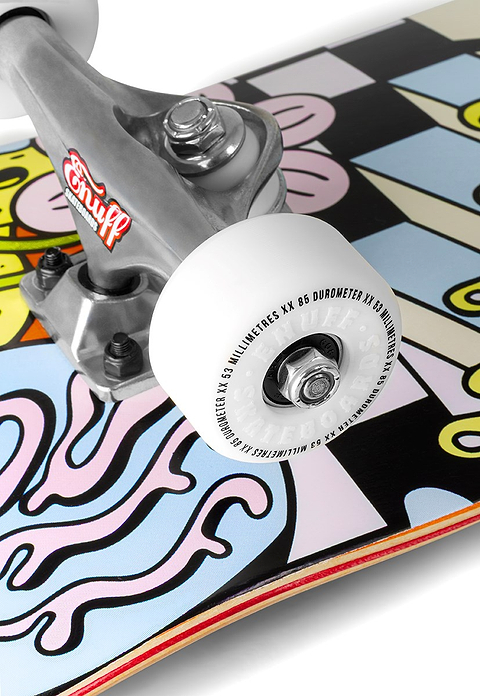 Close-up of the Enuff Meltworld Dazed Complete Skateboard’s wheel and truck on a 7.75" x 31.5" maple deck with vibrant art. The white wheel shows specs, and the metal truck has Enuff branding—ideal for beginner skateboarders.