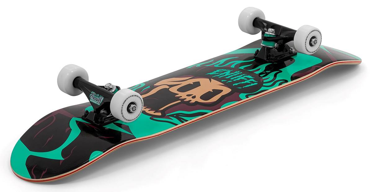 The Enuff Pyro III Blue Complete Skateboard (7.75" x 31.5") by Enuff features a 7-ply maple deck, white wheels, a black background with green and tan skull graphics, ideal as an entry-level board for new skaters.