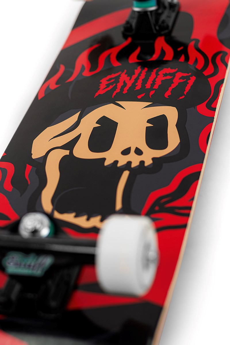 Close-up of the Enuff Pyro III Red Complete Skateboard (7.75" x 31.5") shows a stylized skull with flames and bold red and black colors, plus "ENUFF" in jagged red letters above the skull on this entry-level deck.