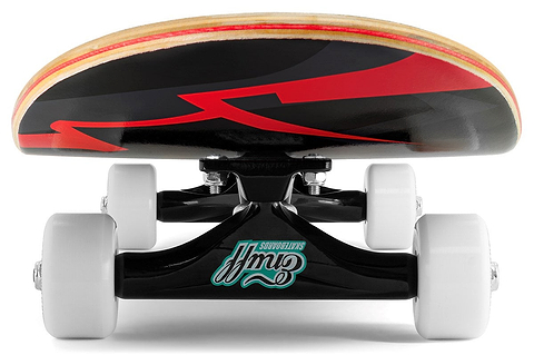 A close-up, low-angle view of the Enuff Pyro III Red Complete Skateboard (7.75" x 31.5") by Enuff reveals white wheels, black trucks with a teal logo, and a striking red and black underside design on its 7-ply maple deck.