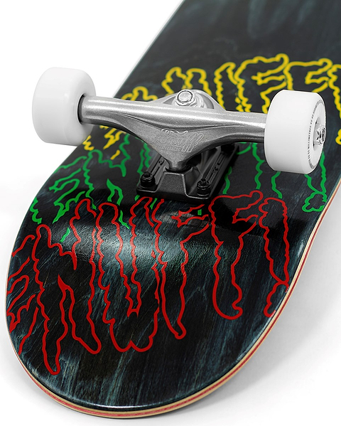 Close-up of the Enuff Three Tier Reloaded Black Complete Skateboard (8.0" x 32.0") tail, showing white wheels, silver trucks, and a dark 7-ply maple deck with red, yellow, and green wavy graphic text.
