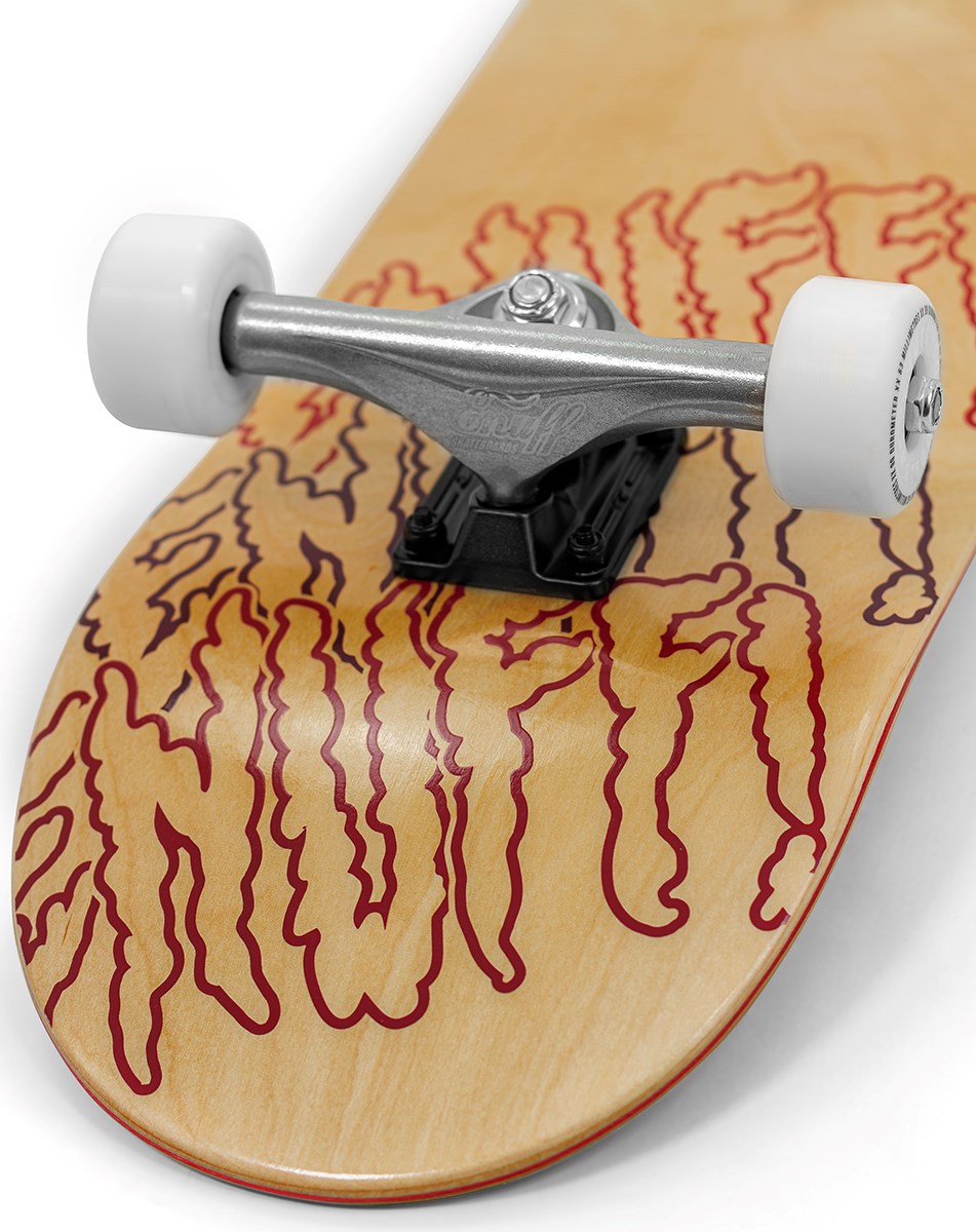 A close-up of the Enuff Three Tier Reloaded Natural Complete Skateboard (8.0" x 32.0") shows its 7-ply maple deck with red wavy lettering, metal trucks, and white wheels with ABEC 7 bearings by Enuff.