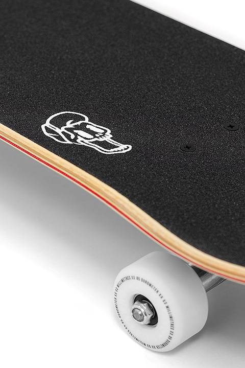 Close-up of the Enuff Lost At Sea Goldfish Complete Skateboard (8.0" x 32.0") shows black grip tape with a white face-in-helmet outline, wooden deck edges, and a white wheel—an ideal beginner board from Enuff.