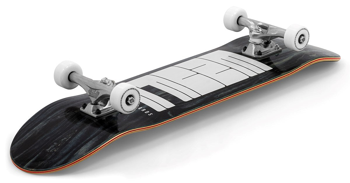 The Enuff Throwback Black Complete Skateboard (8.5" x 32.1") by Enuff, features a bold white geometric design on a black 7-ply maple deck, metallic trucks, and white wheels, displayed on a white background.