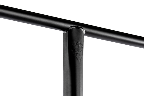 Close-up of a black Ethic DTC Tenacity V2 Oversized HIC Stunt Scooter T-Bar (770mm x 600mm) in durable 4130 chromoly steel, showing weld marks and an embossed ADTC shield logo on the upright bar, against a white background.