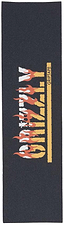 Introducing the Grizzly Graphic Skateboard Griptape - Firestarter by Grizzly: a rectangular black griptape featuring bold, flaming “GRIZZLY” lettering and smaller yellow “GRIPTAPE” text. This flame-inspired design provides a coarse grit texture for dependable board control.