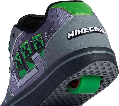 A close-up of the Heelys x Minecraft Pro 25 Prints Boys Shoes - Grey / Green shows green Creeper graphics, “MINECRAFT” text on the heel, and a green wheel in the sole—ideal for boys.
