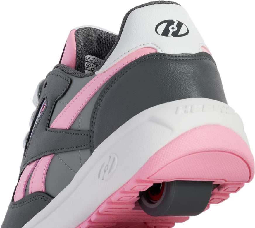 Close-up of Heelys x Reebok Classic Girls Shoes - Grey / Pink / White featuring a retractable heel wheel, branded logos, and a soft padded collar—perfect for skate park style.