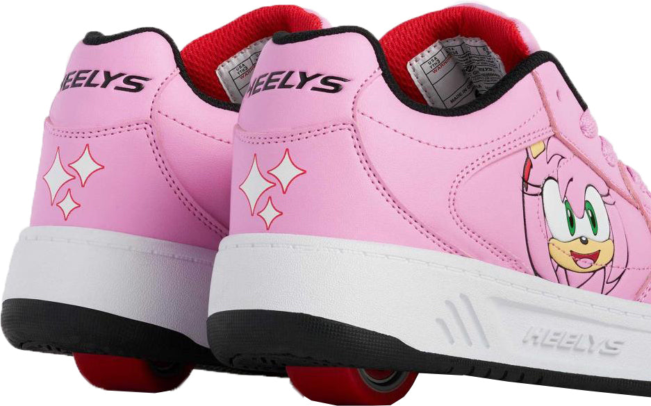 Heelys x Sonic Gio Girls Shoes in rose pink, featuring a Sonic the Hedgehog character on the side, diamond-shaped icons on the heel, and a single red wheel in the sole.