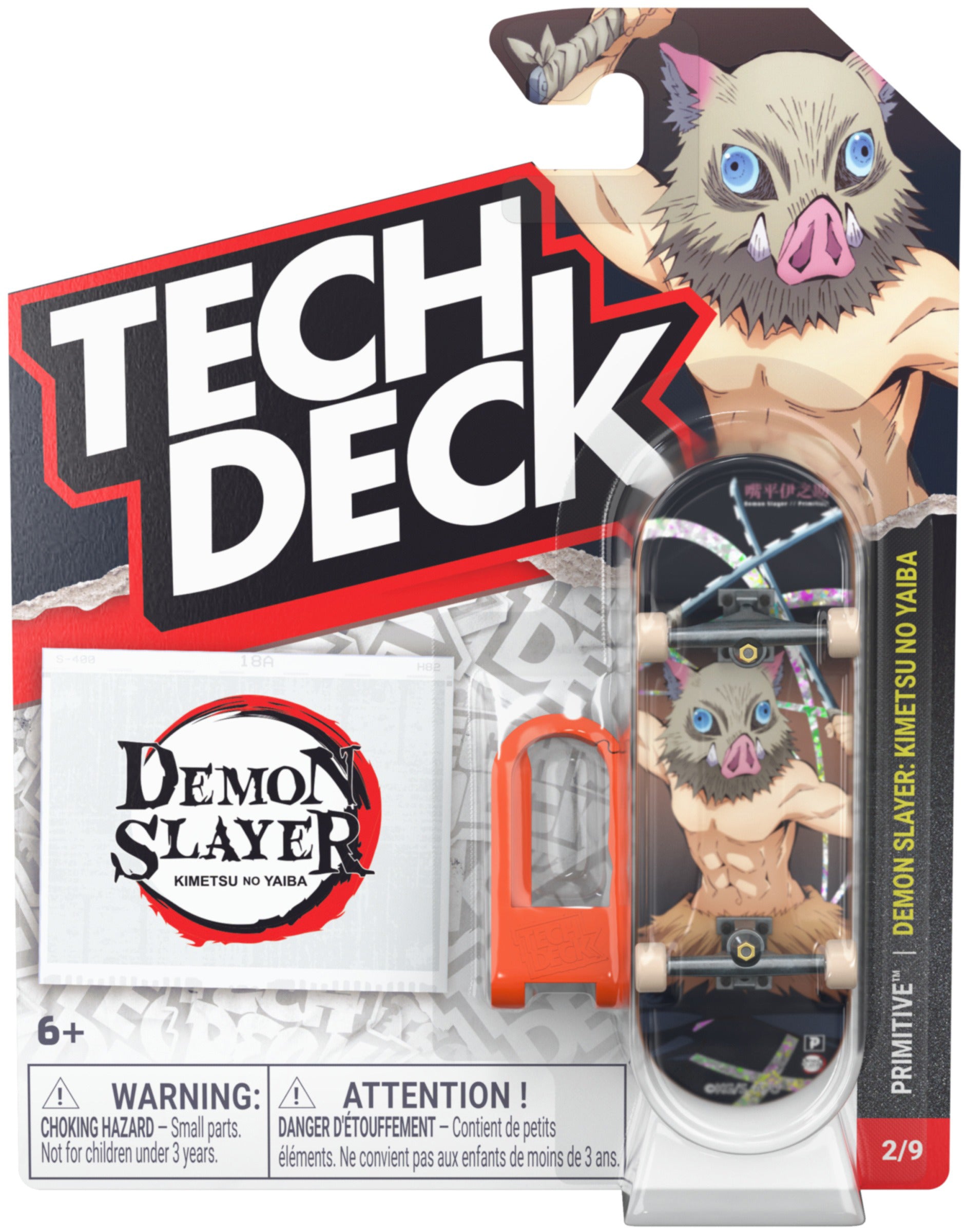 The Tech Deck 96mm M04 Primitive x Demon Slayer Fingerboard—Inosuke Hashibira edition—comes in packaging featuring the “Demon Slayer” theme and showcases the character Inosuke Hashibira. This collectible set from Tech Deck includes a 96mm fingerboard, a tool, and a logo sticker, making it ideal for skateboard collectibles enthusiasts. Warning labels are displayed prominently on the front of the packaging.