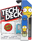 The Tech Deck 96mm M04 Santa Cruz Fingerboard - Marge Simpson by Tech Deck features Marge Simpson’s face, includes a blue tool and a Santa Cruz Simpsons sticker, and comes in branded packaging displaying “Simpsons” and “6/9” in the bottom right corner along with a warning label.
