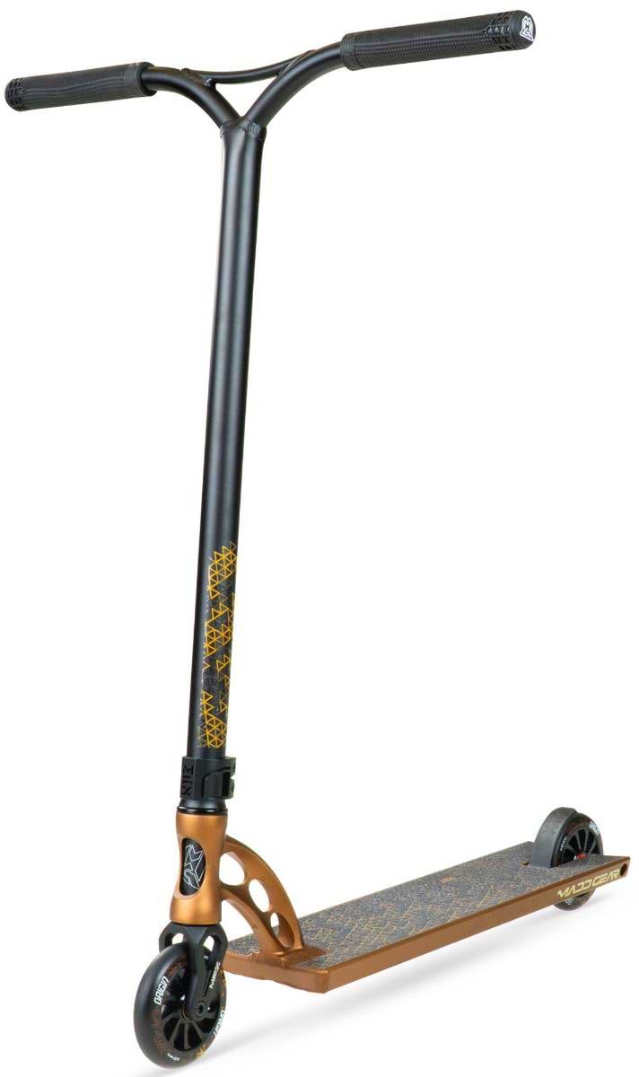 The Madd Gear MGP VX Origin IV 550 Complete Stunt Scooter in Rust features wide bars, black grips, small black wheels, and a textured bronze deck—ideal for park riders who want style and high performance.