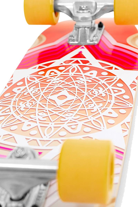 Close-up of the Mindless Drifter Cruiser Skateboard 28″ x 8″ - Orange featuring vibrant geometric and mandala graphics in pink, orange, and white with yellow wheels and silver trucks for standout urban style.