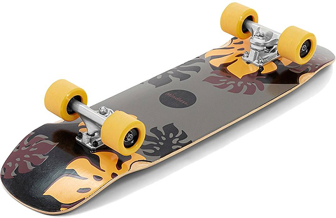 The Mindless Oasis Cruiser Skateboard 32″ x 9″ - Black by Mindless features a maple deck with orange and brown leaf patterns, silver trucks, and bright yellow wheels, shown from a low angle.