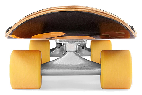 Ground-level close-up of the Mindless Oasis Cruiser Skateboard 32″ x 9″ - Black, featuring its wide orange wheels, silver trucks, and sleek black maple deck.