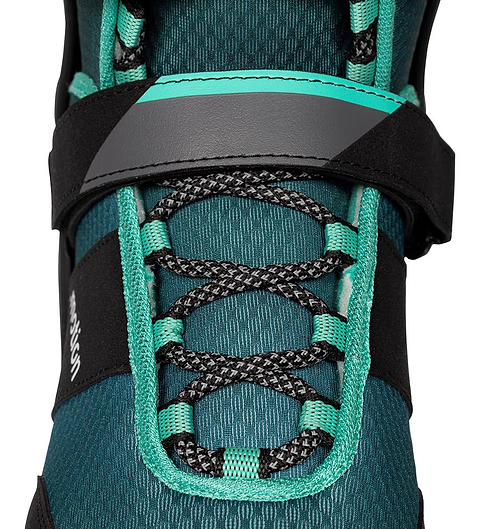 Close-up of a .motion Dreamstate Inline Skates - Teal, featuring black laces and a wide hook-and-loop strap across the ankle.