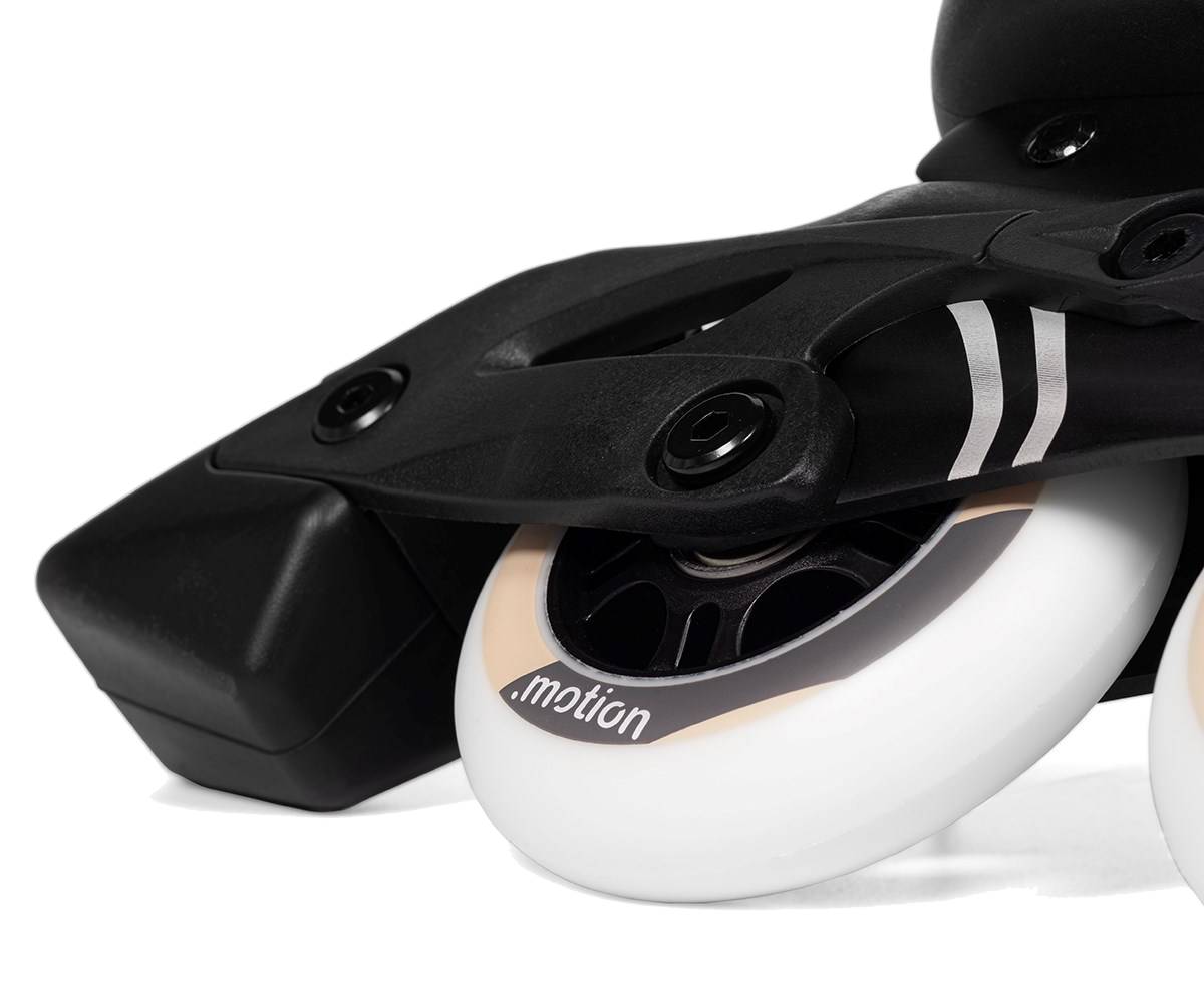 Close-up of a beige and black 84mm PU wheel and frame with ABEC 7 bearings on a .motion Dreamstate Fly Inline Skate - Sand.