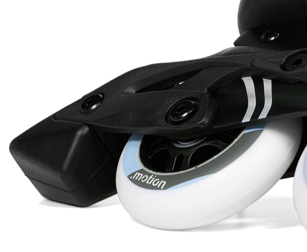 Close-up of .motion Dreamstate Fly Inline Skates - Sky showing a white 84mm PU wheel and the black plastic frame.