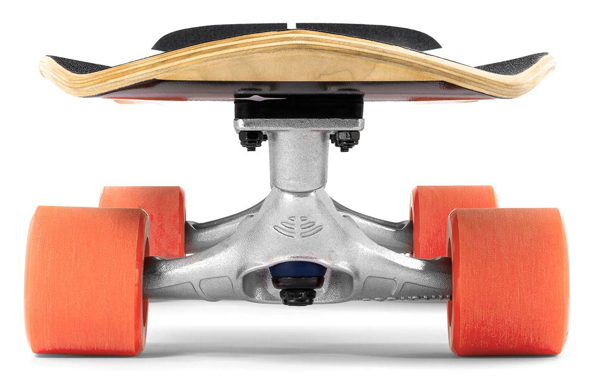A close-up, low-angle view of a Mindless Soul Surf Skate Cruiser Skateboard 29.5″ x 9.75″ - Red featuring large orange wheels, a silver truck, and wood deck with black grip tape; focus is on the underside of the surf skate.