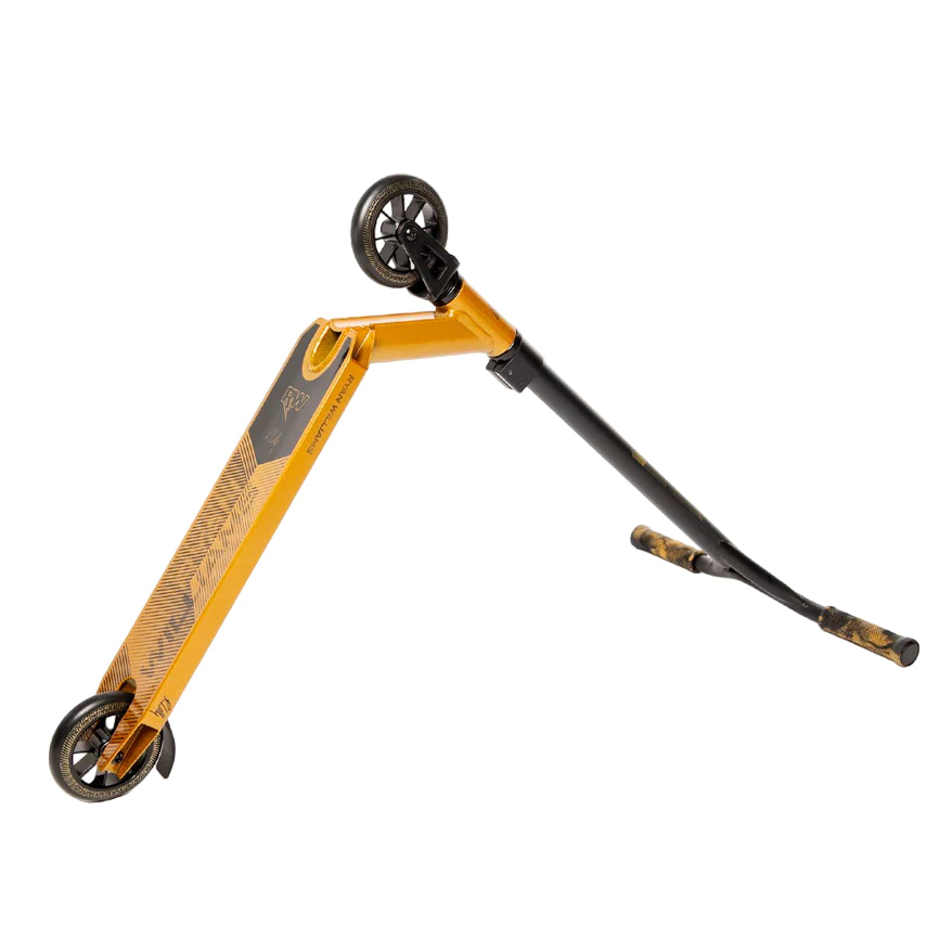 The Nitro Circus Ryan Williams Signature Replica 2025 Complete Stunt Scooter in gold and black is shown tilted on its side, with one wheel raised to display the deck, handlebars, and wheels against a white background.