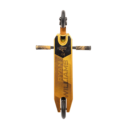The Nitro Circus Ryan Williams Junior Replica 2025 Complete Stunt Scooter in gold and black is pictured vertically from above, showing its angular deck design and two side pegs, with one wheel at the top and one at the bottom.