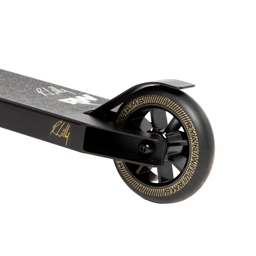 Close-up of the rear wheel on the Nitro Circus Ryan Williams Junior Replica 2025 Complete Stunt Scooter in black, featuring black spokes, gold rim detailing, and textured grip tape on the deck.