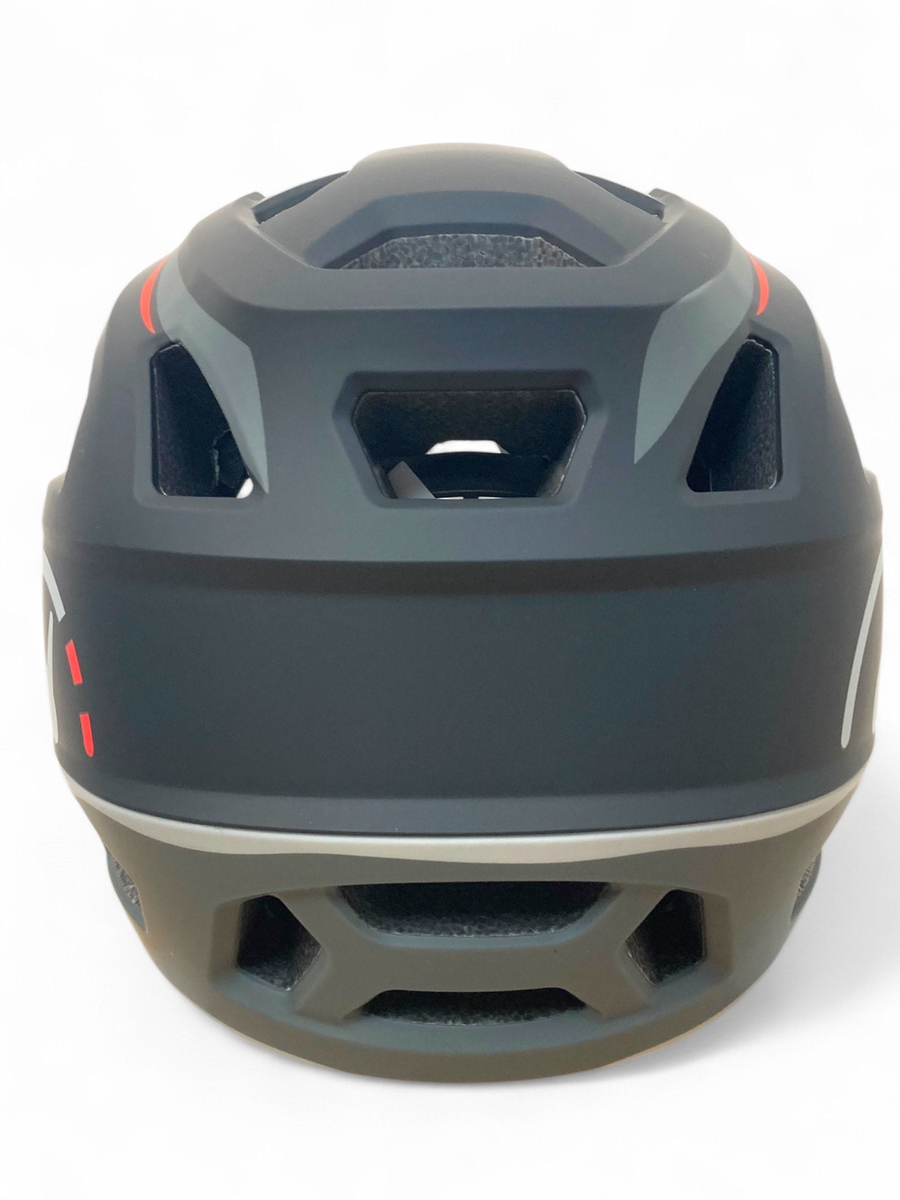 The Revvi Kids Full Face MTB Helmet by Revvi in matte black features geometric rear vents, red and gray accents, and a sleek, aerodynamic design.
