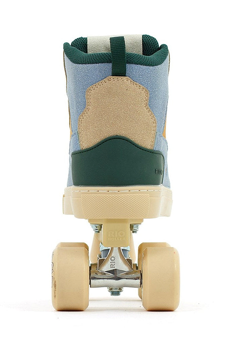 The Rio Roller Beats Quad Roller Skates by Rio Roller feature a retro design with a tan suede heel, blue upper, green accents, beige sole, and cream wheels—vegan-friendly and shown from the back against a white background.