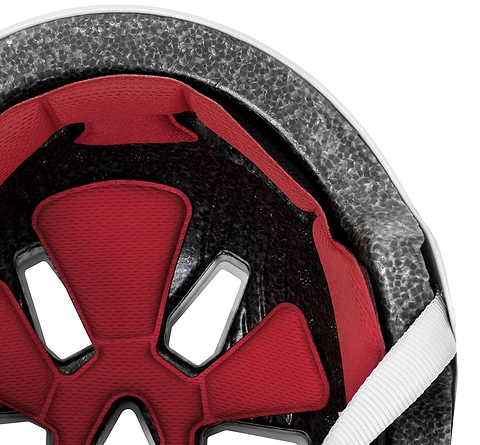 Close-up of the REKD Elite 2.0 Skate / Scooter Helmet - Gloss Silver by REKD, showing red padding, black vents, grey foam lining, and a white strap—demonstrating this certified helmet’s comfort and safety features for action sports.