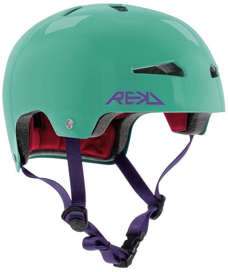 The REKD Elite 2.0 Skate / Scooter Helmet in gloss teal features a purple REKD logo, dark purple adjustable straps, and red interior padding. Lightweight, certified, and comfortable—perfect for safe cycling or skating adventures.